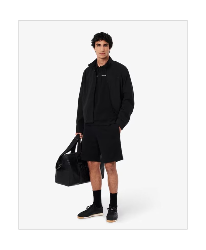 Polo negro L.12.12 regular ribete blanco logotipo LACOSTE